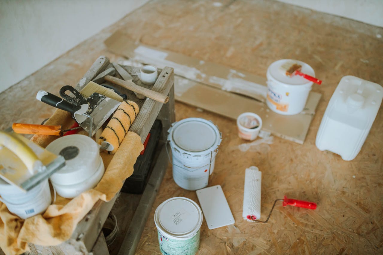 about-01 Overhead shot of tools and paint supplies for a home renovation project.